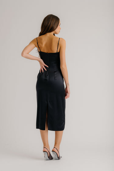 a woman in a black dress